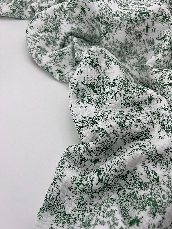 M 105 C2 Муслін жатка 2-х шаровий принт Діор зелений на молочному 100% бавовна 135-140 см 125-135 гр